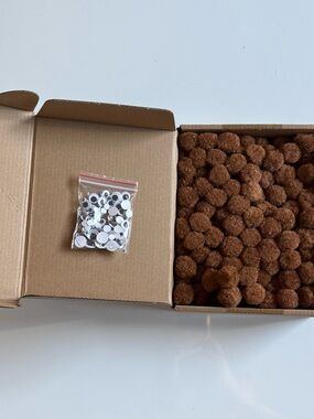 Set of brown pom poms